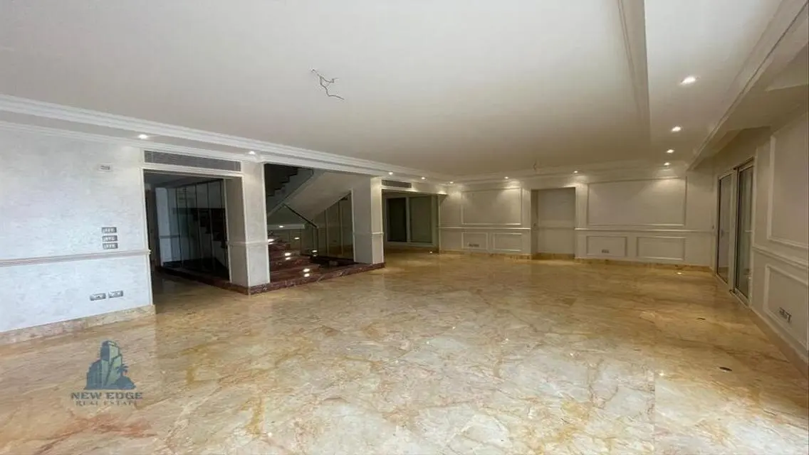 Luxurious Five-Bedroom Apartment with Private Garden and Shared Pool