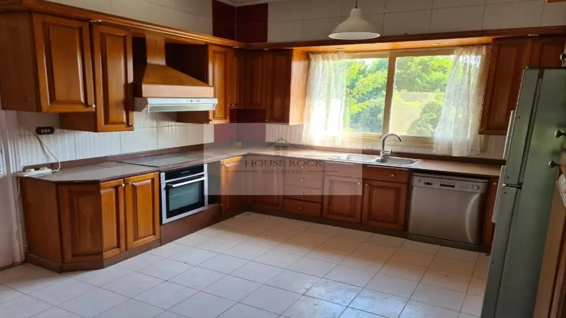 Luxurious Property with Balcony, Private Garden, and Pool in Prime Location
